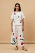 White wide-leg pants with flower embroidery